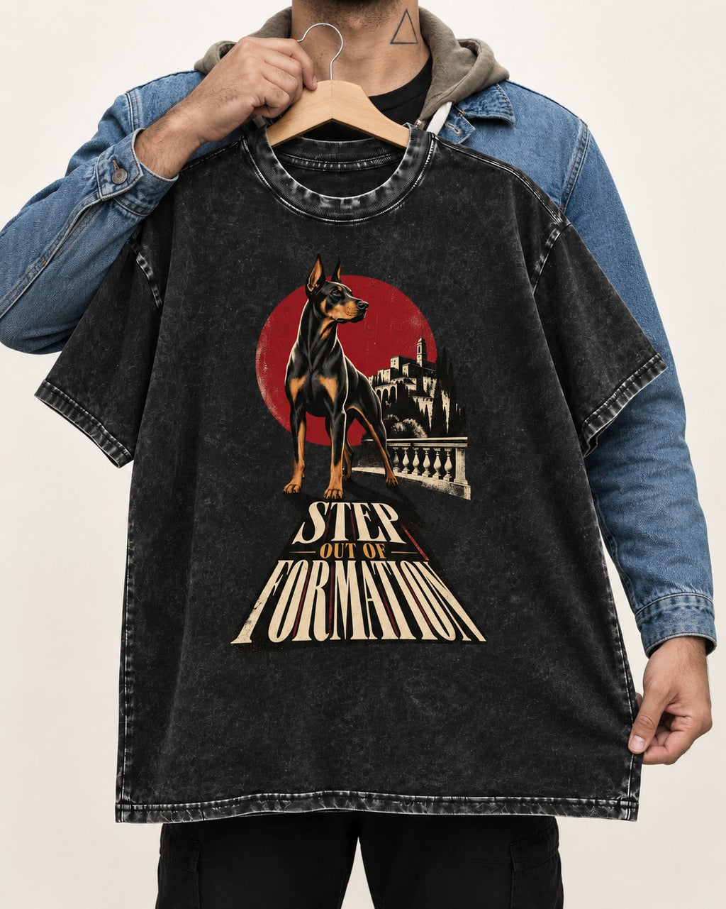 Doberman Step Out of Formation Road Vista Graphic Washed Tee in Black, held up on a hanger