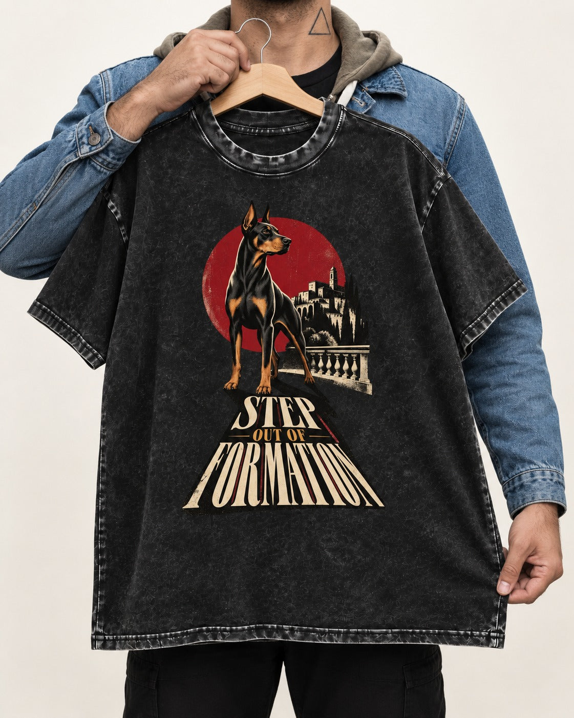 Doberman Step Out of Formation Road Vista Graphic Washed Tee in Black, held up on a hanger