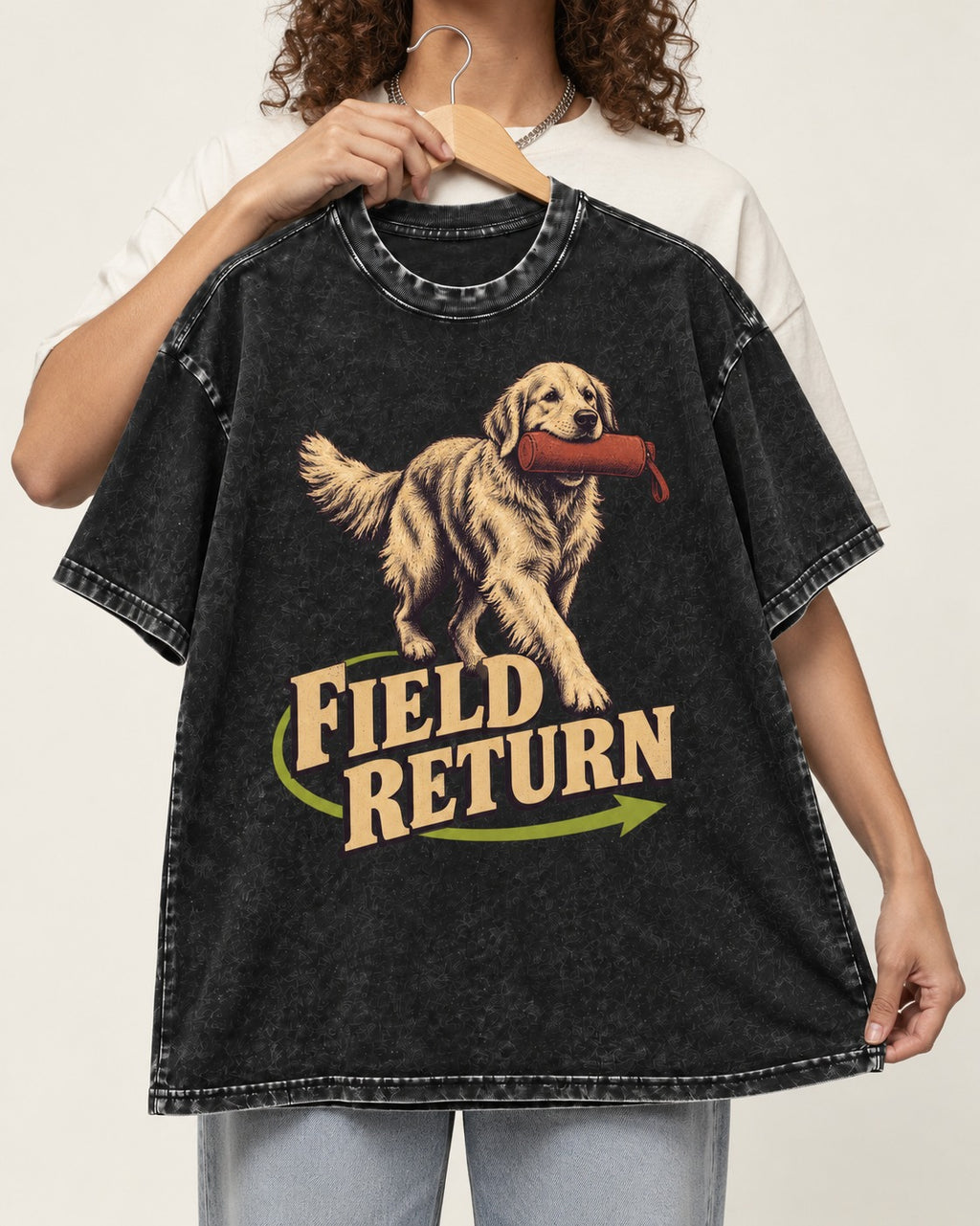 Golden Retriever Field Return Training Dummy Graphic Washed Tee in Black, held up on a hanger