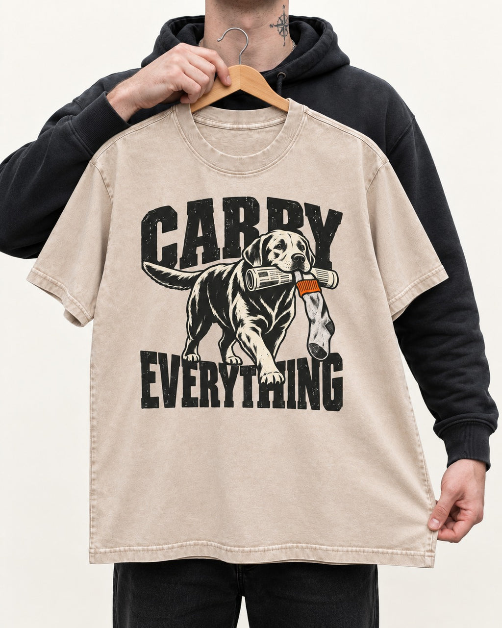 Carry Everything Labrador Retriever Washed Tee in Apricot, held up on a hanger