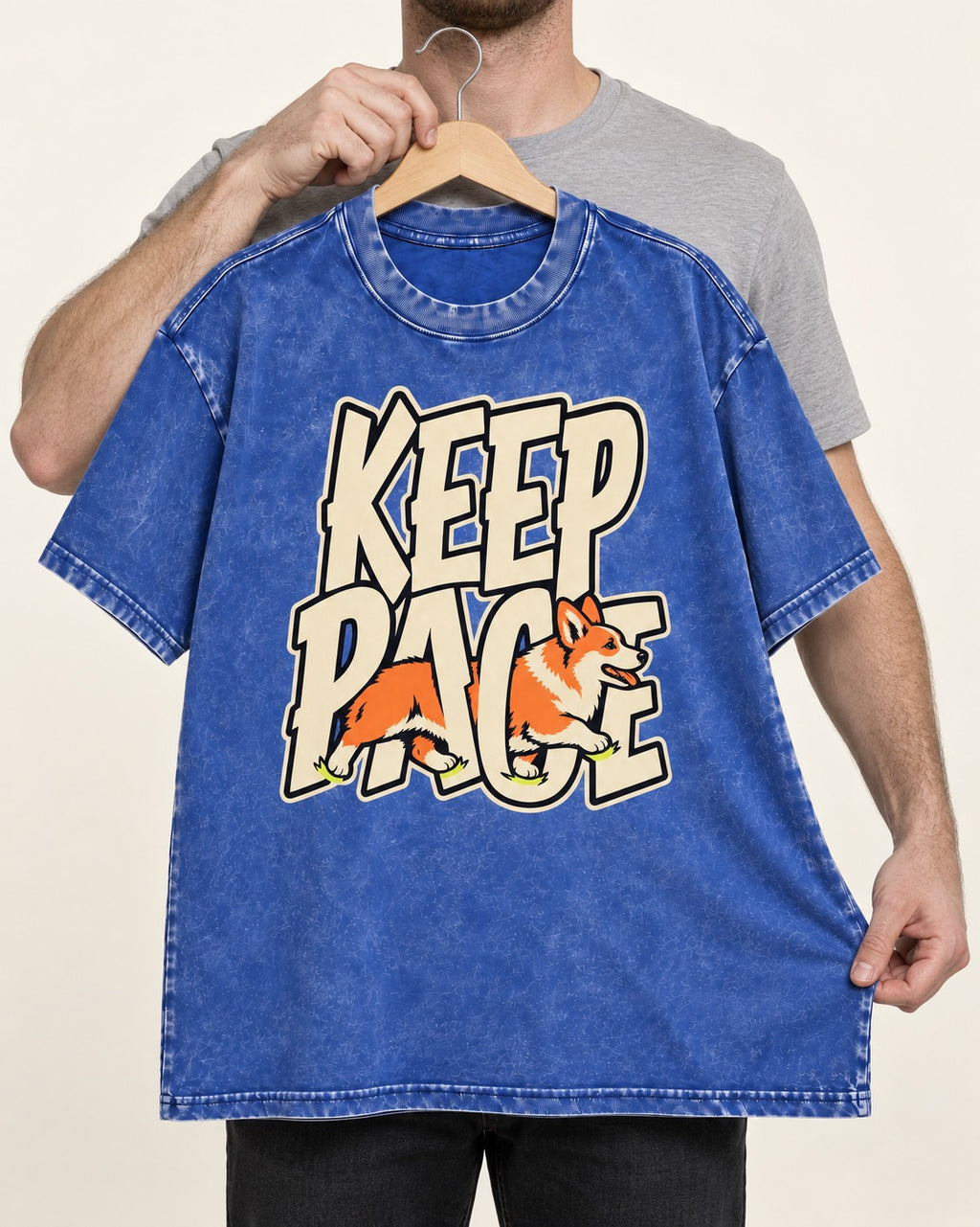 Corgi Keep Pace Running Typographic Graphic Washed Tee in Royal Blue, held up on a hanger