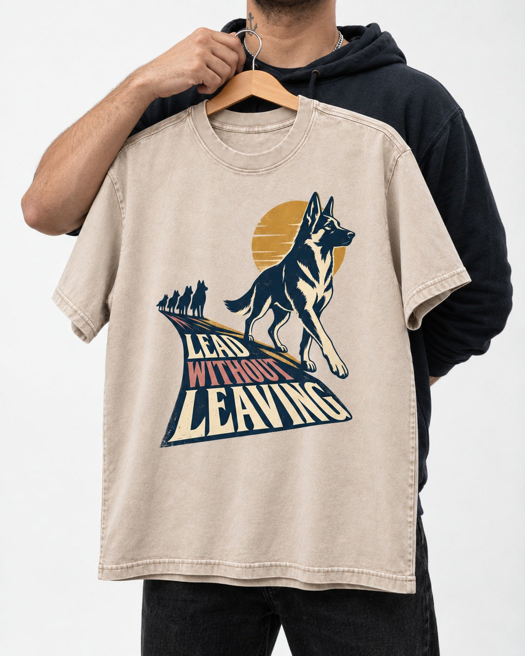 Lead Without Leaving Perspective German Shepherd Dog Graphic Washed Tee in Apricot, held up on a hanger
