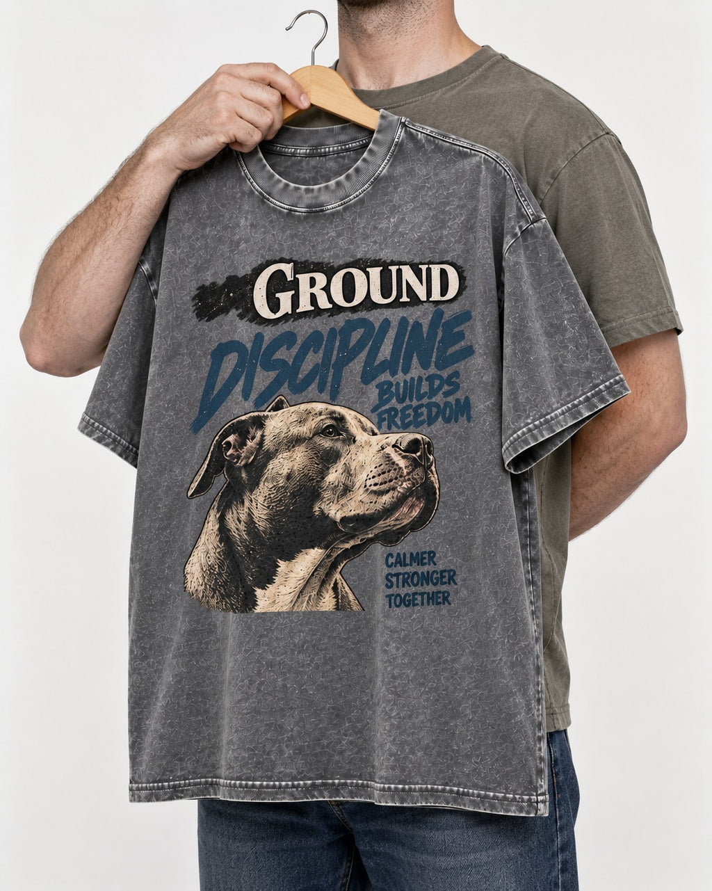 Pitbull Discipline Builds Freedom Washed Tee in Gray, held up on a hanger