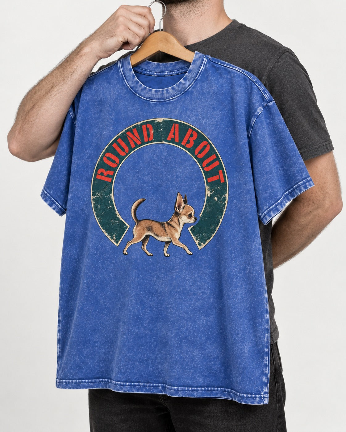 Round About Chihuahua Emblem Graphic Washed Tee in Royal Blue, held up on a hanger