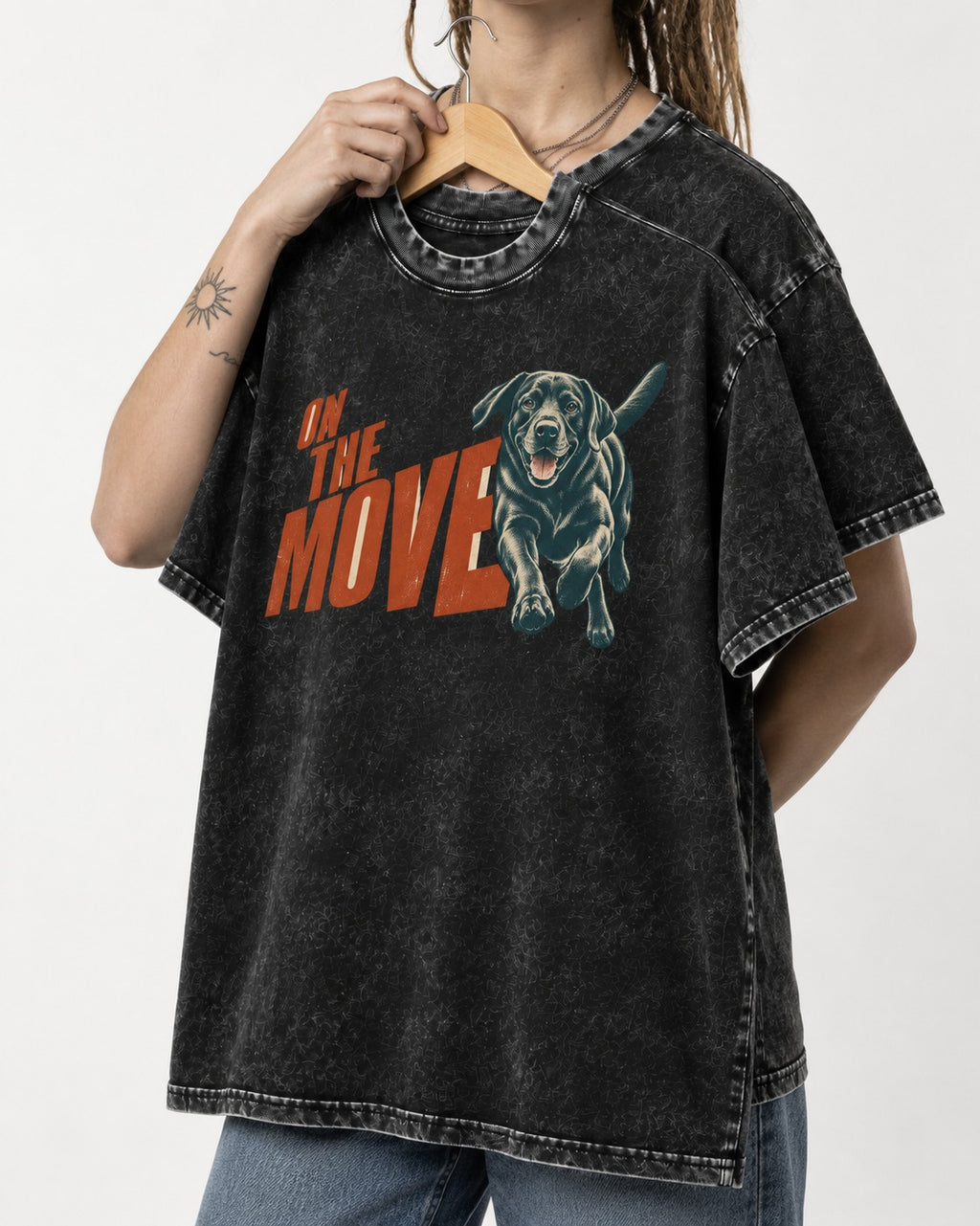 Labrador Retriever On the Move Running Graphic Washed Tee in Black, held up on a hanger