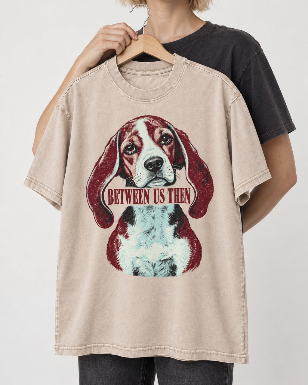 Beagle Between Us Then Washed Tee in Apricot, held up on a hanger