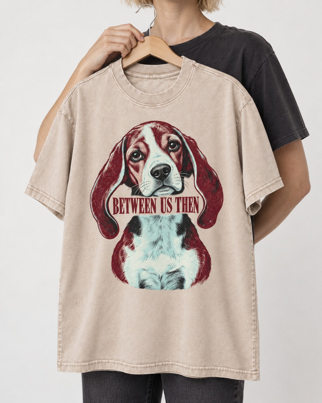 Beagle Between Us Then Washed Tee in Apricot, held up on a hanger
