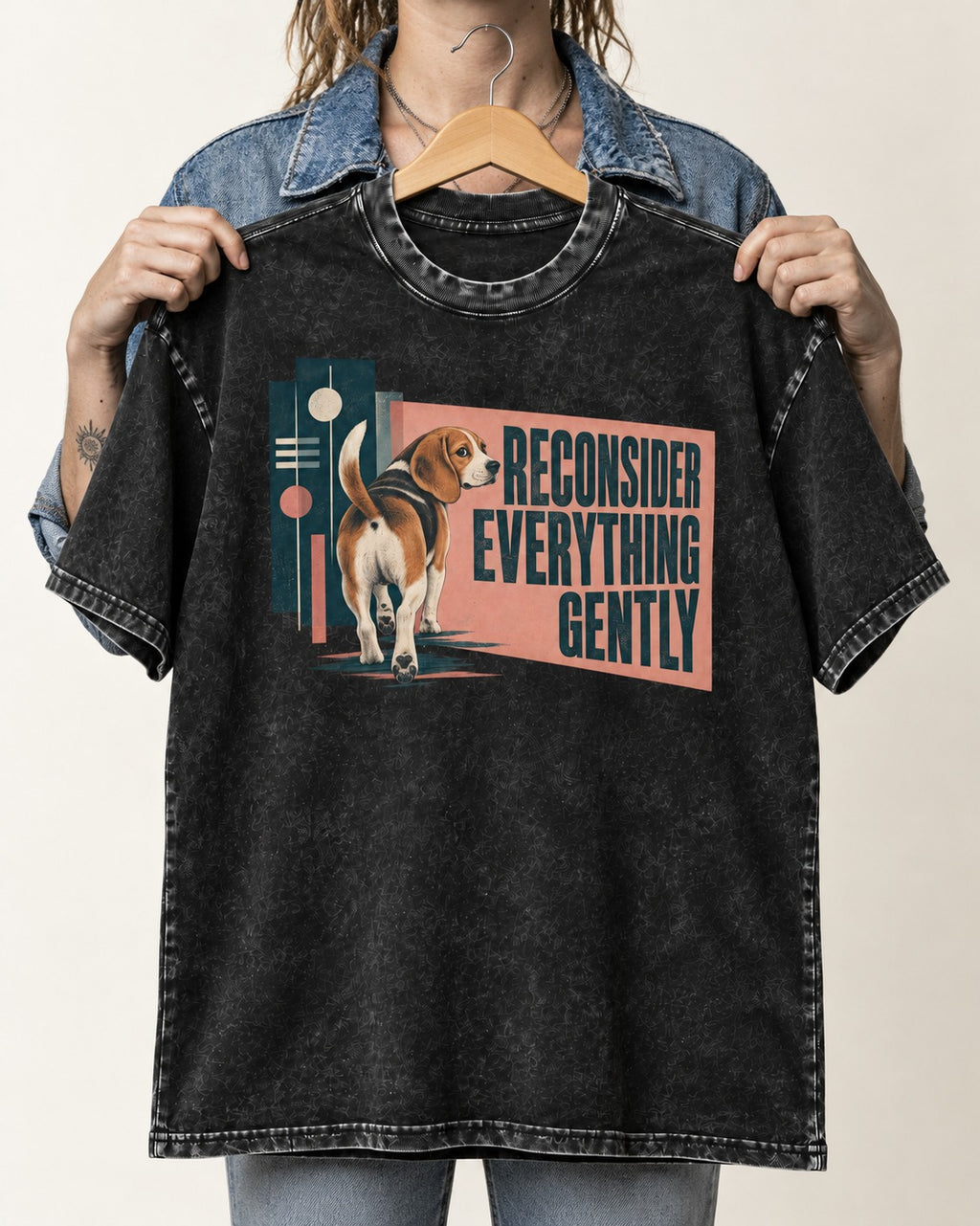 Beagle Reconsider Everything Gently Retro Graphic Washed Tee in Black, held up on a hanger