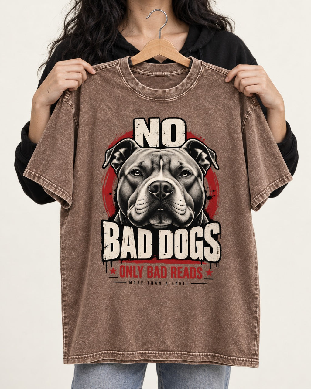 Pitbull Only Bad Reads Washed Tee in Coffee, held up on a hanger