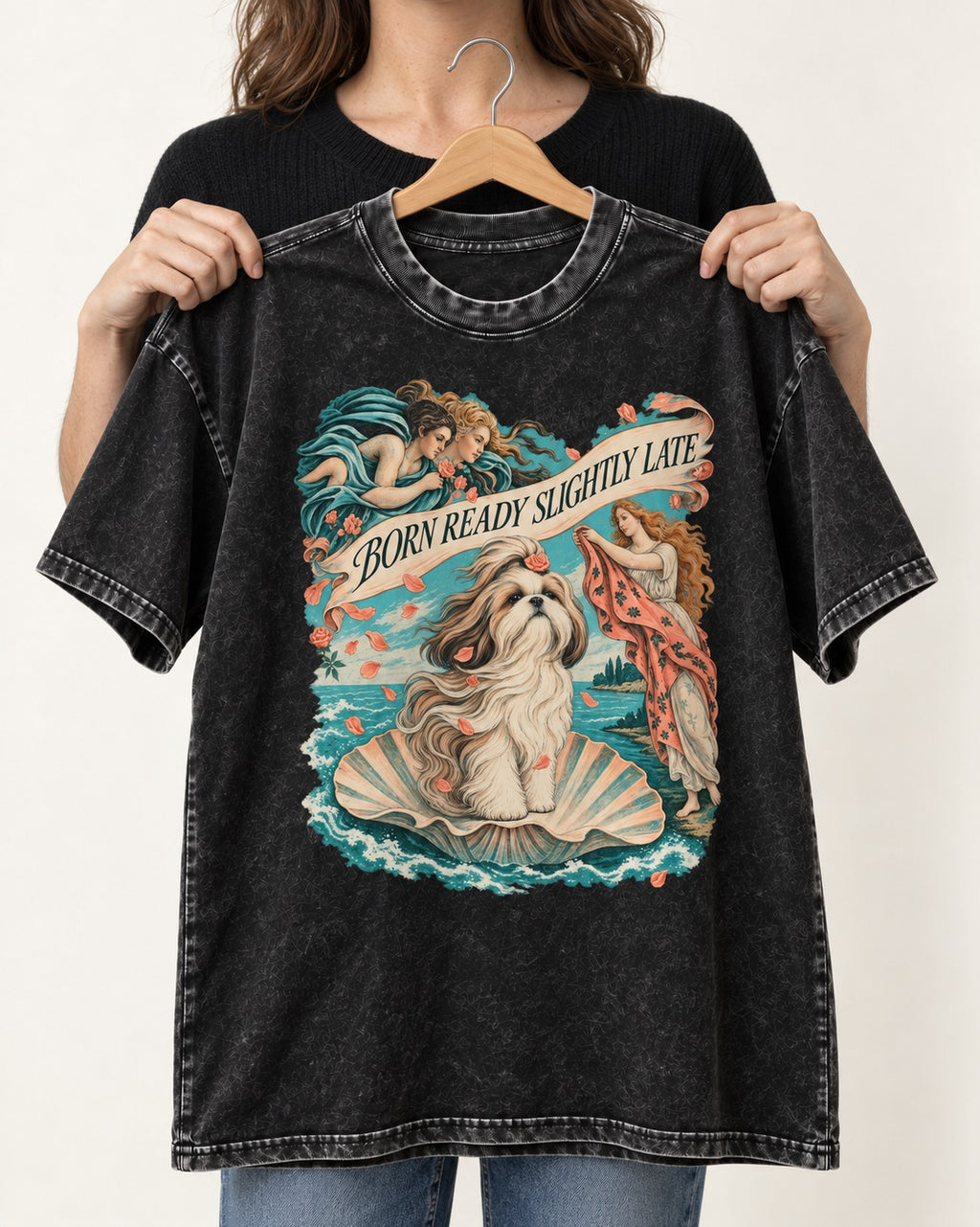 Shih Tzu Born Ready Slightly Late Venus Graphic Washed Tee in Black, held up on a hanger