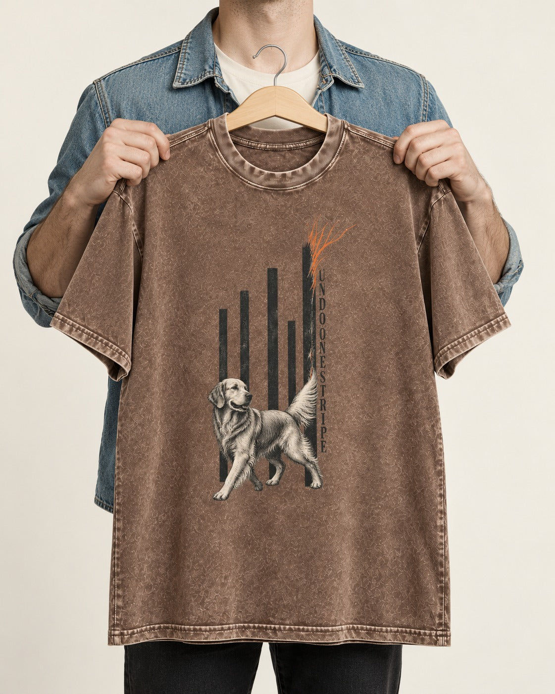 Undo One Stripe Golden Retriever Washed Tee in Coffee, held up on a hanger