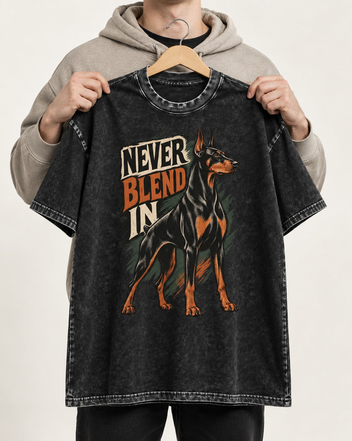 Doberman Never Blend In Brush Graphic Washed Tee in Black, held up on a hanger
