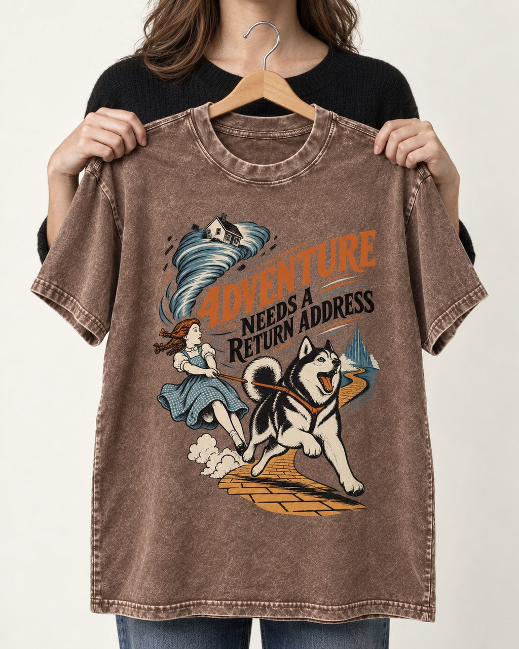 Husky Needs a Return Address Washed Tee in Coffee, held up on a hanger