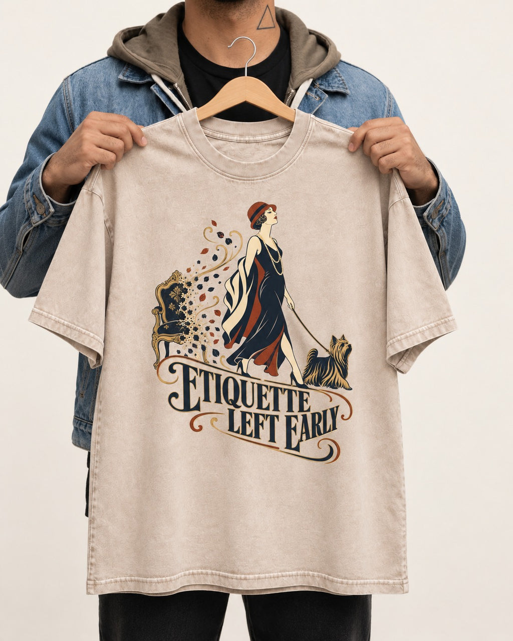 Yorkshire Terrier Etiquette Left Early Washed Tee in Apricot, held up on a hanger