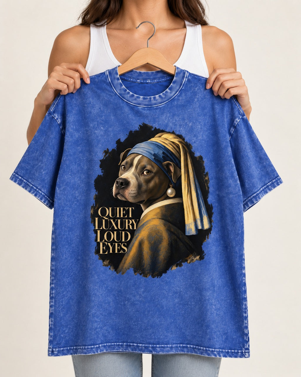 Pitbull Quiet Luxury Loud Eyes Pearl Earring Portrait Graphic Washed Tee in Royal Blue, held up on a hanger