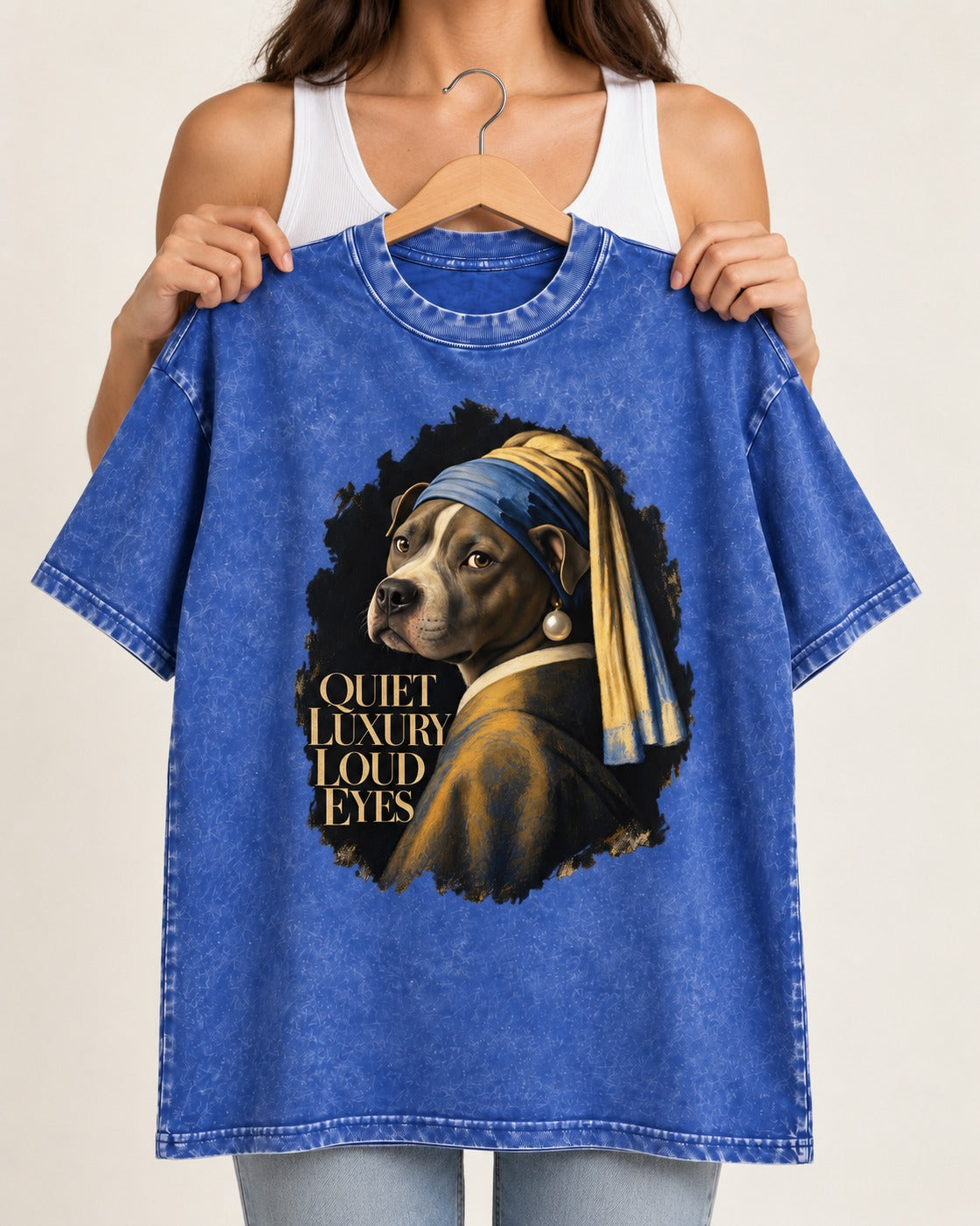 Pitbull Quiet Luxury Loud Eyes Pearl Earring Portrait Graphic Washed Tee in Royal Blue, held up on a hanger