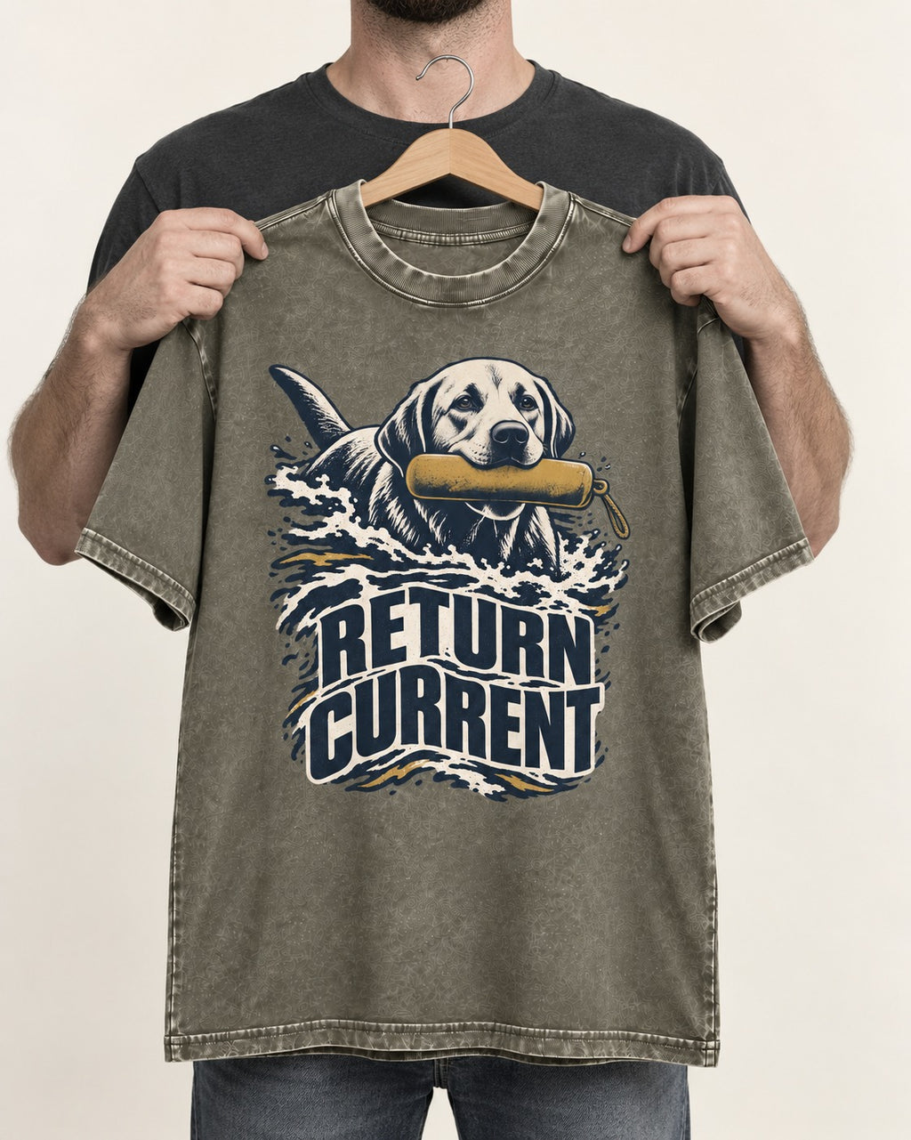Return Current Water Retrieve Labrador Retriever Graphic Washed Tee in Army Green, held up on a hanger