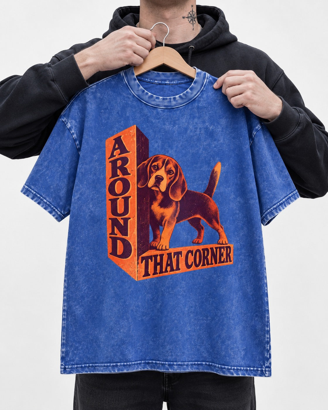 Beagle Around That Corner Graphic Washed Tee in Royal Blue, held up on a hanger