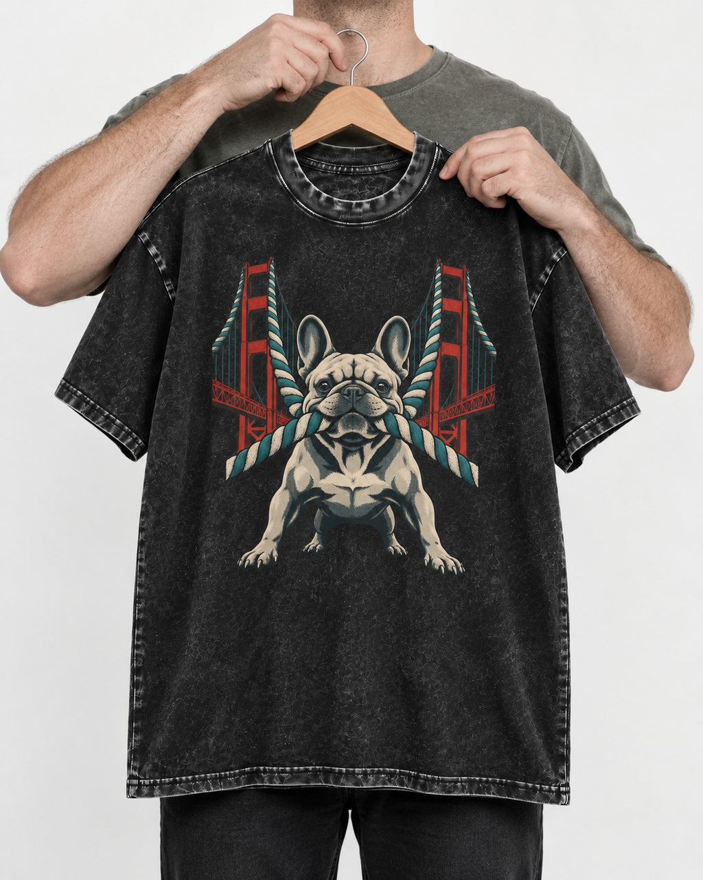 Frenchie Tug Anchor Bridge Graphic Washed Tee in Black, held up on a hanger