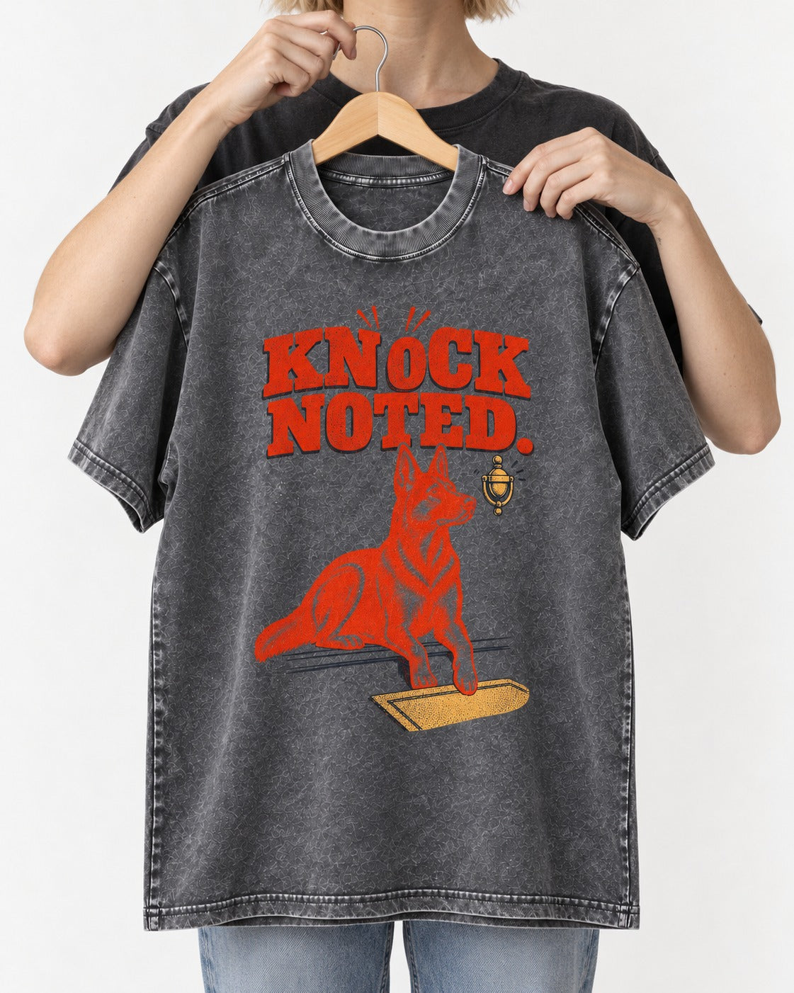 Knock Noted Door Knocker German Shepherd Dog Graphic Washed Tee in Gray, held up on a hanger