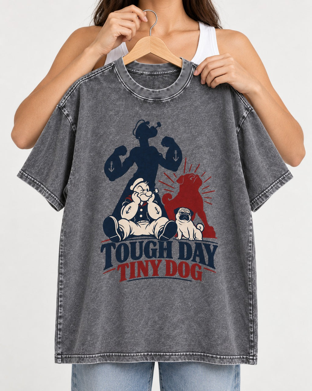 Tough Day Tiny Pug Washed Tee in Gray, held up on a hanger