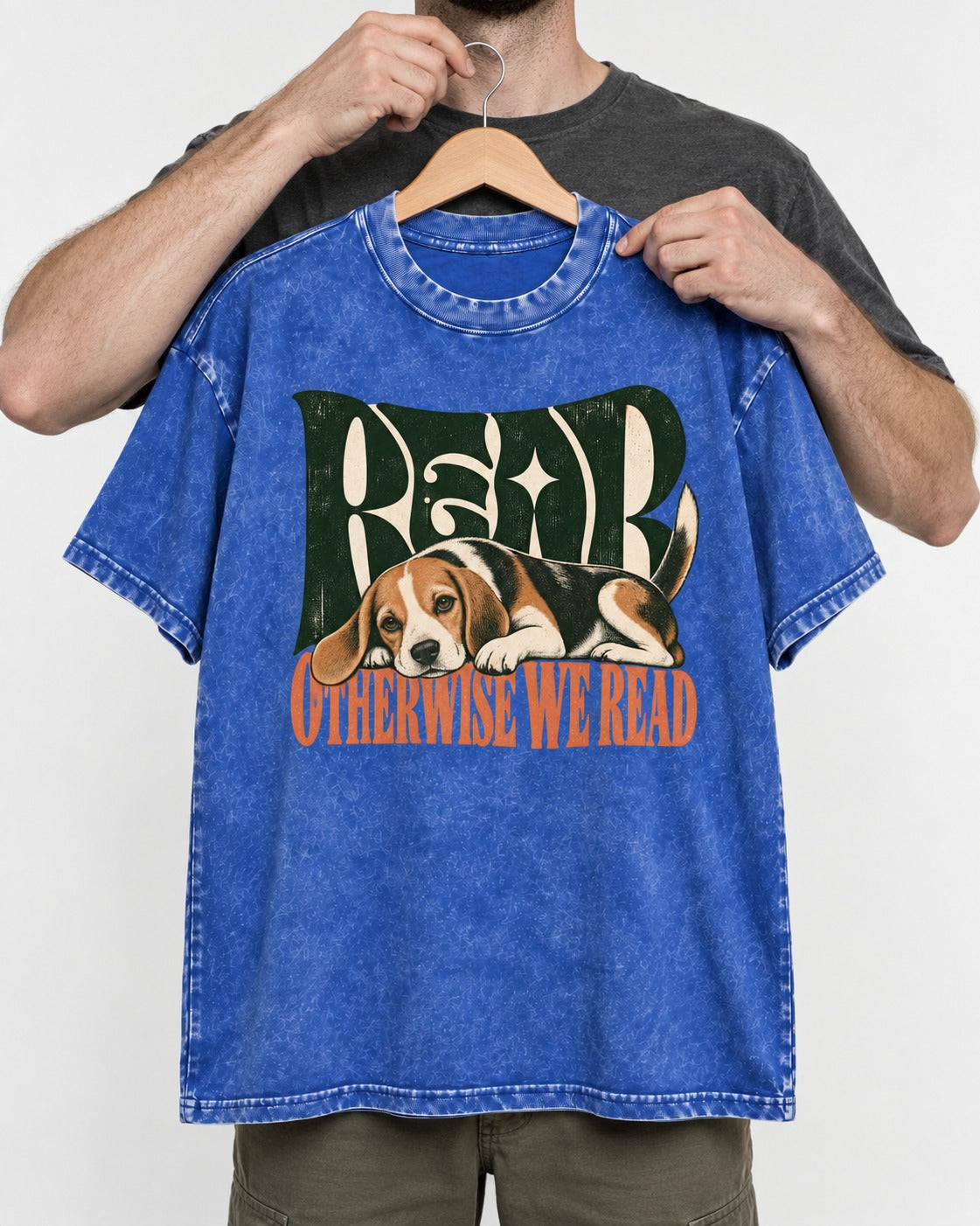 Beagle Read Otherwise We Read Retro Graphic Washed Tee in Royal Blue, held up on a hanger