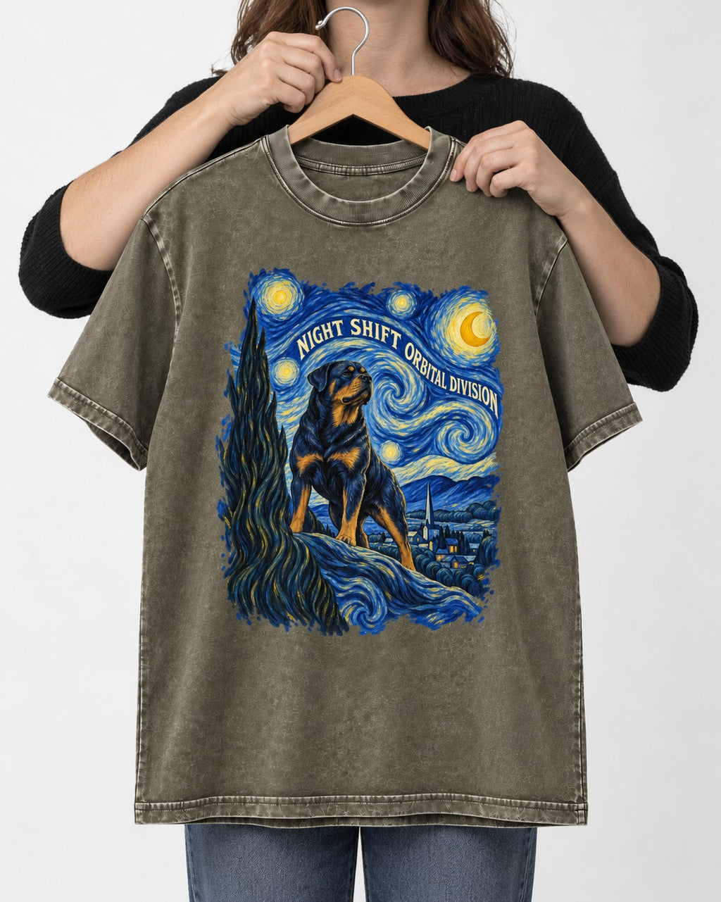 Rottweiler Night Shift Orbital Division Starry Night Graphic Washed Tee in Army Green, held up on a hanger