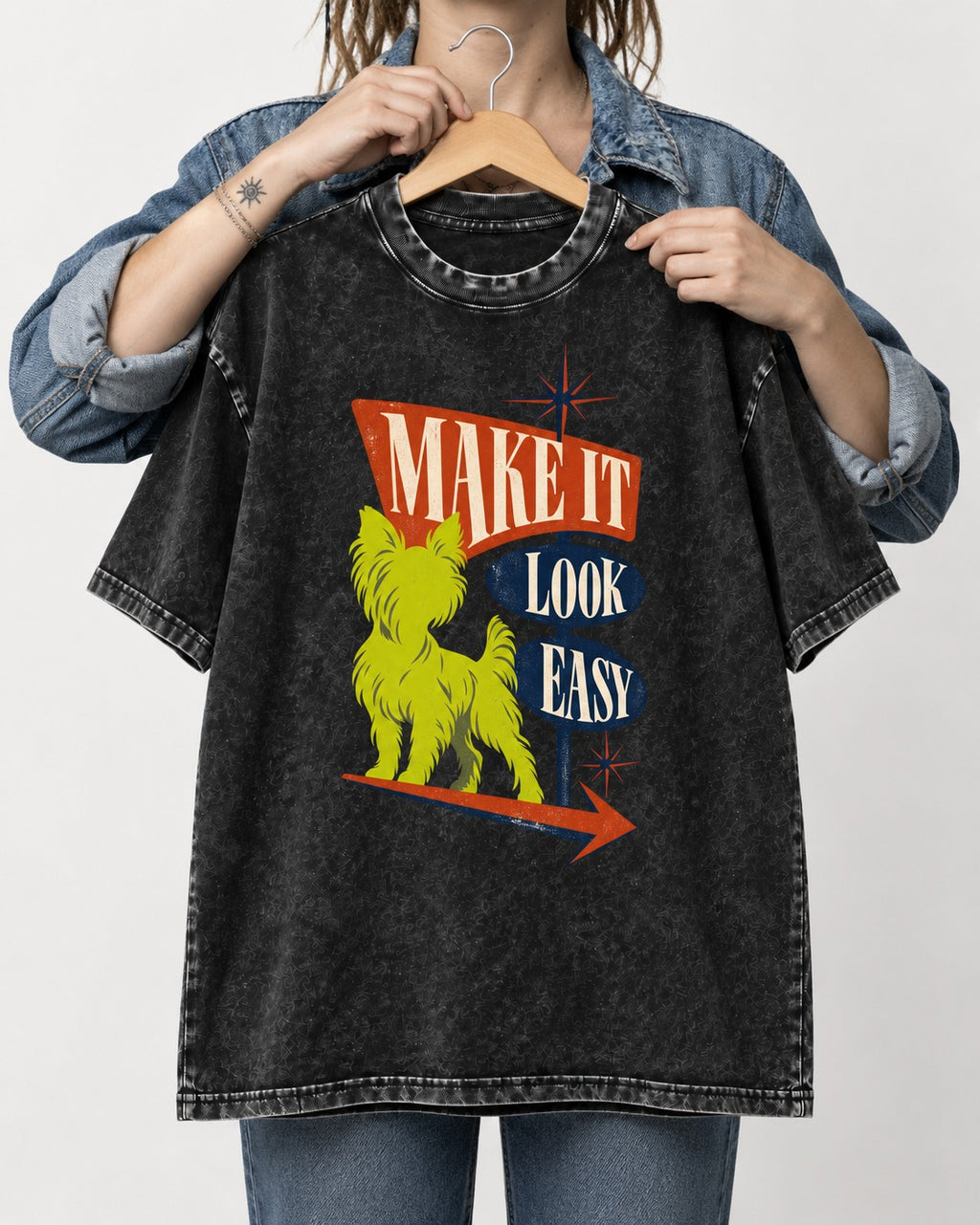 Yorkshire Terrier Make It Look Easy Retro Sign Graphic Washed Tee in Black, held up on a hanger