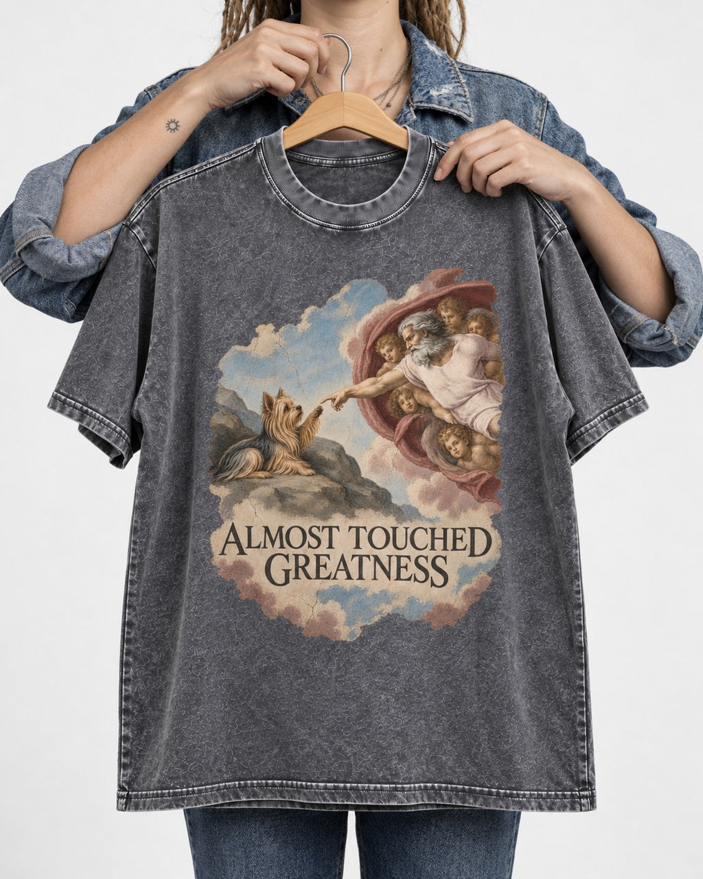 Yorkshire Terrier Almost Touched Greatness Creation Parody Graphic Washed Tee in Gray, held up on a hanger