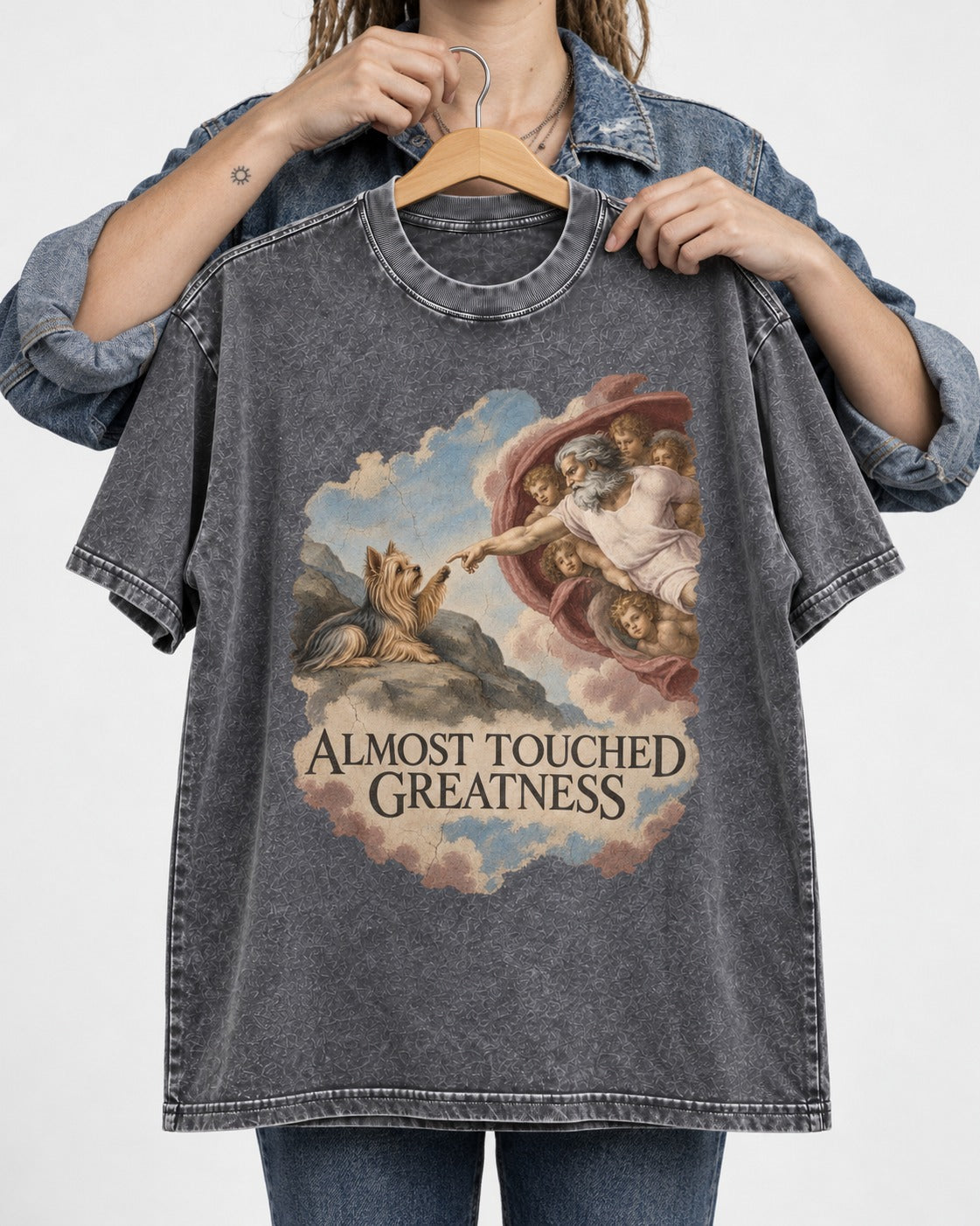 Yorkshire Terrier Almost Touched Greatness Creation Parody Graphic Washed Tee in Gray, held up on a hanger