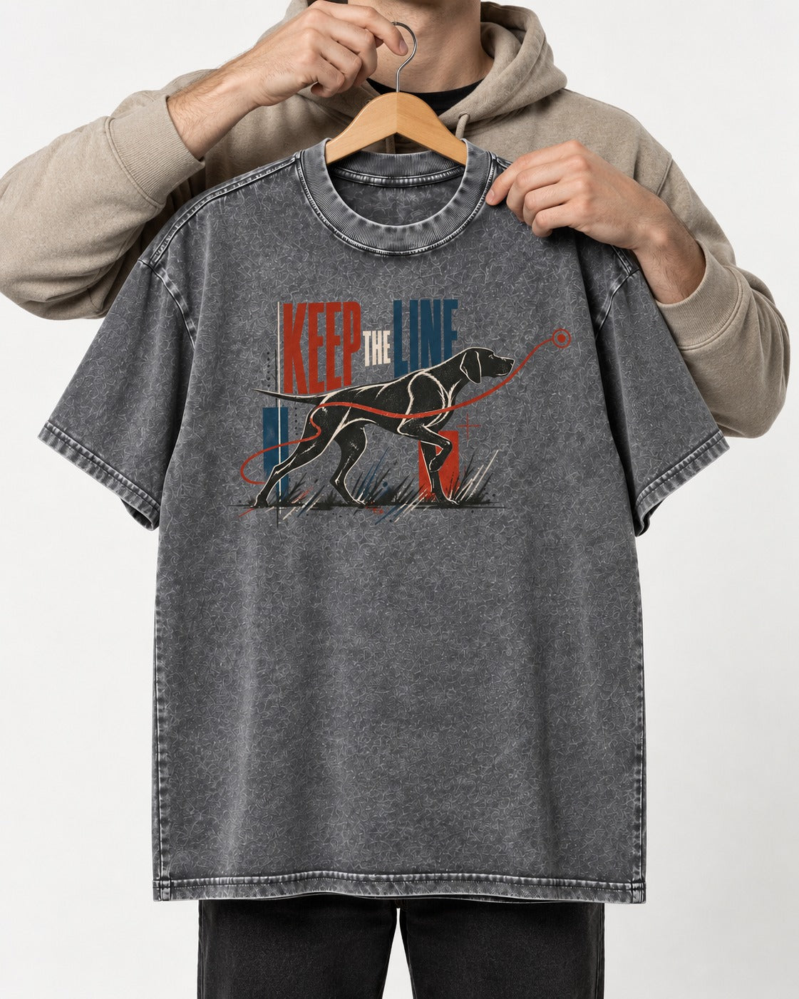 Keep the Line German Shorthaired Pointer Washed Tee in Gray, held up on a hanger