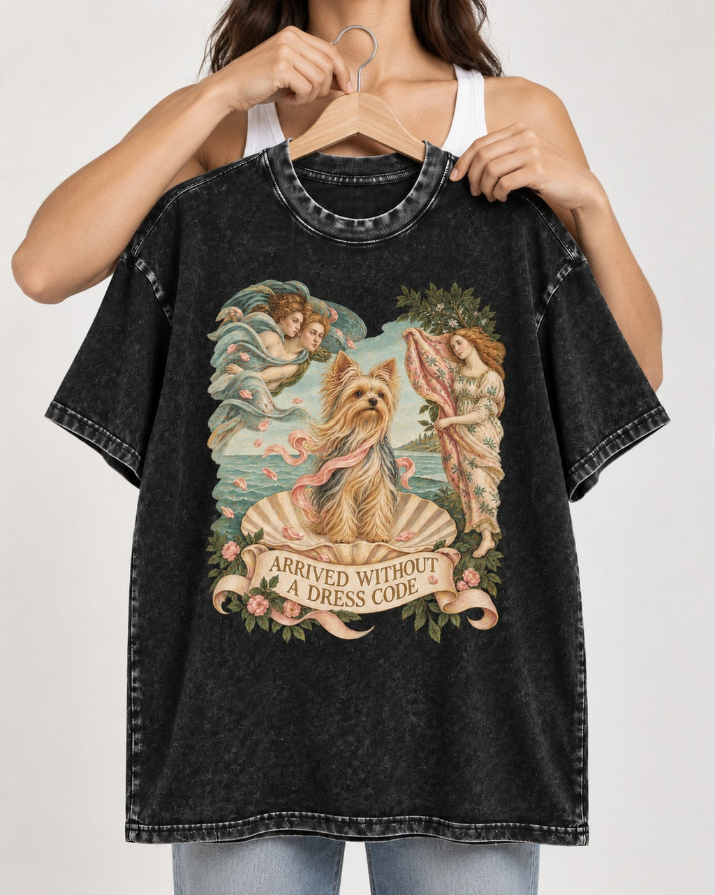 Yorkshire Terrier Arrived Without a Dress Code Venus Graphic Washed Tee in Black, held up on a hanger