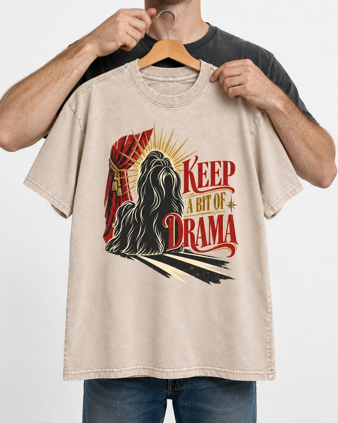 Shih Tzu Keep a Bit of Drama Theater Graphic Washed Tee in Apricot, held up on a hanger