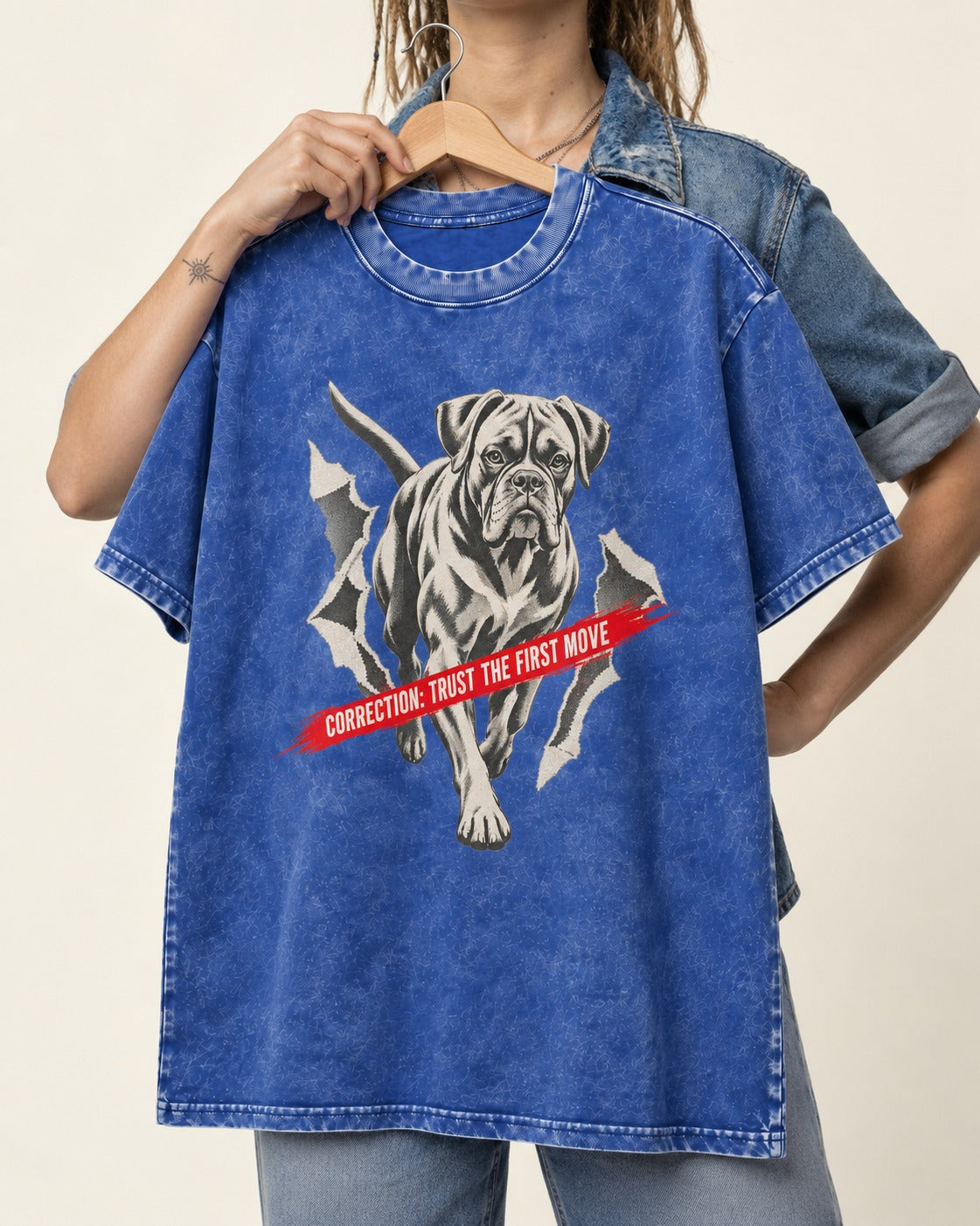 Mastiff Mismatch Boxer Needs Review Washed Tee in Royal Blue, held up on a hanger