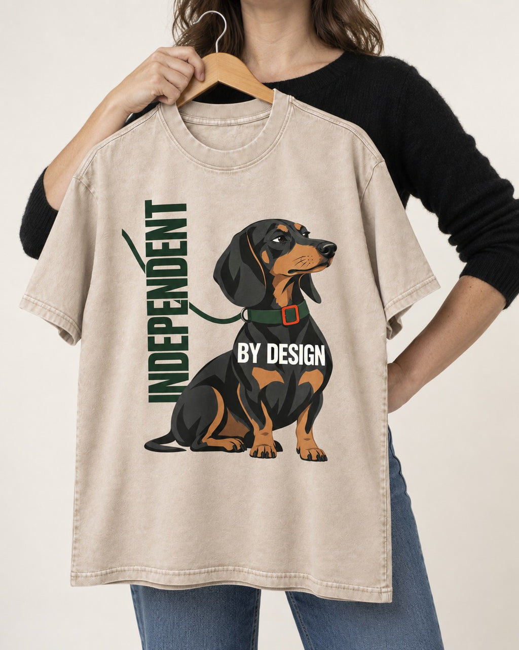 Independent Dachshund Washed Tee in Apricot, held up on a hanger