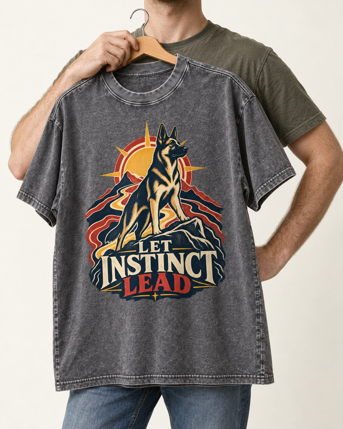 Let Instinct Lead Sunrise German Shepherd Dog Graphic Washed Tee in Gray, held up on a hanger