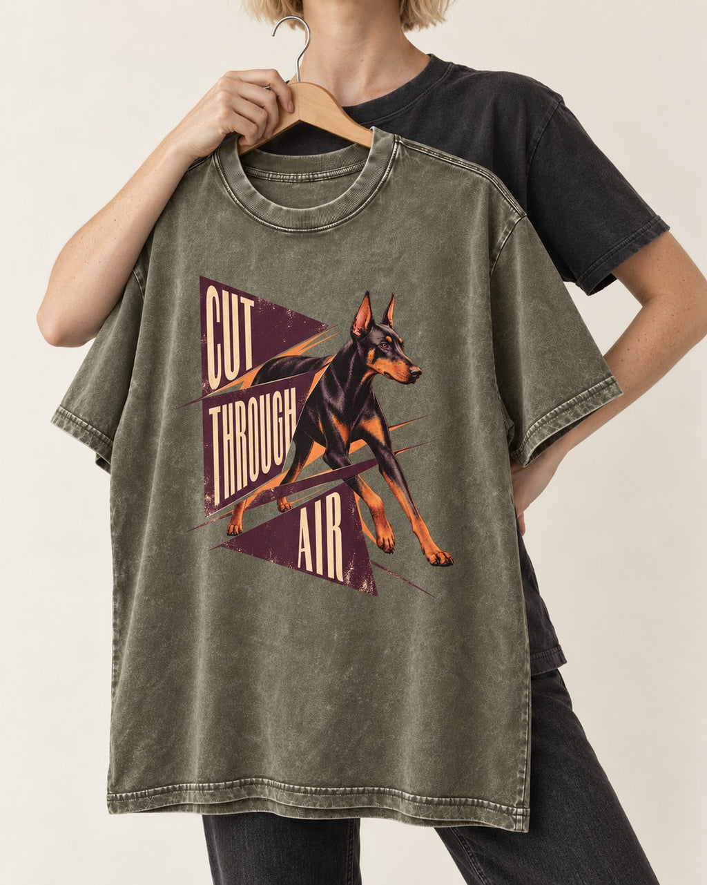 Doberman Cut Through Air Graphic Washed Tee in Army Green, held up on a hanger