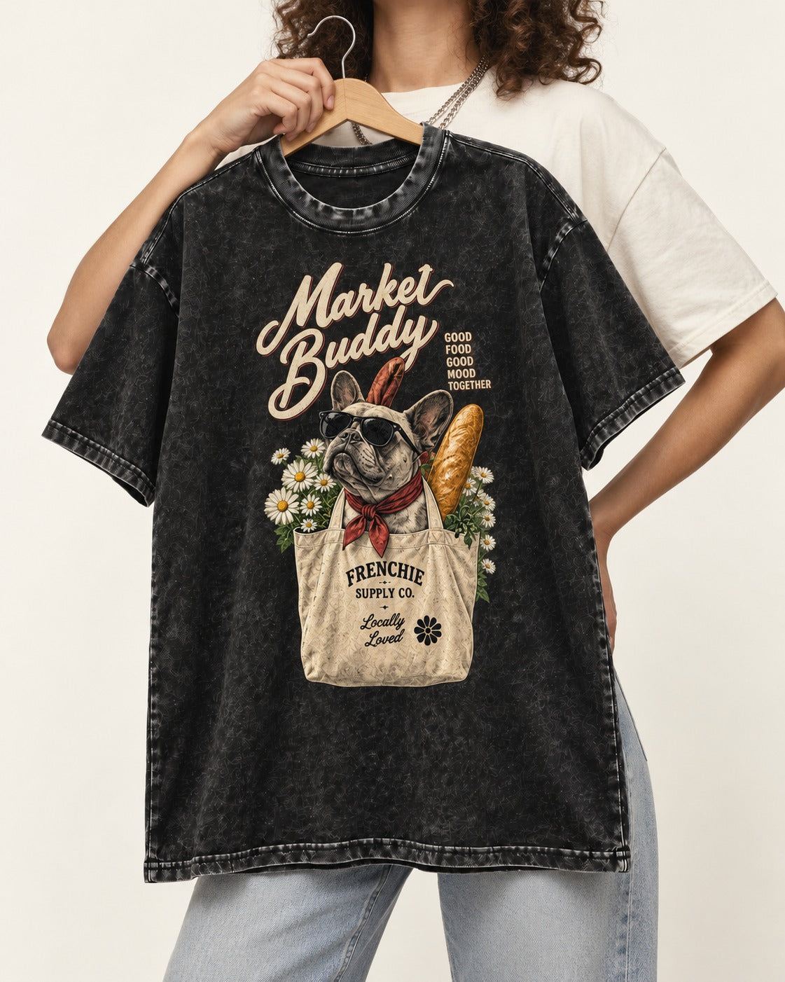 Frenchie Market Buddy Grocery Tote Graphic Washed Tee in Black, held up on a hanger