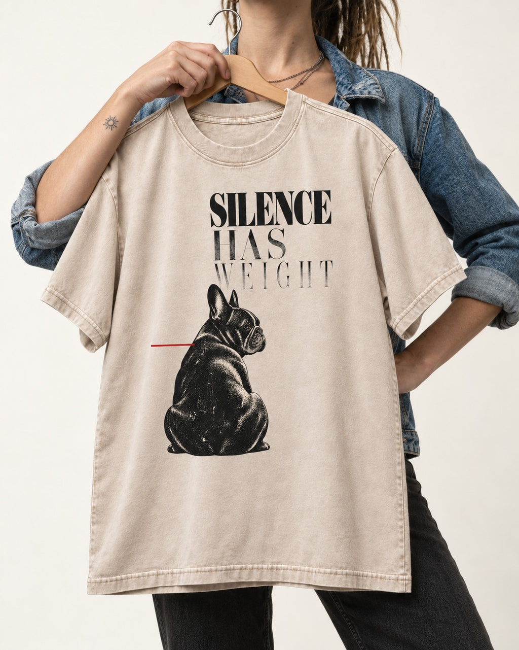 Silence Has Weight Frenchie Washed Tee in Apricot, held up on a hanger