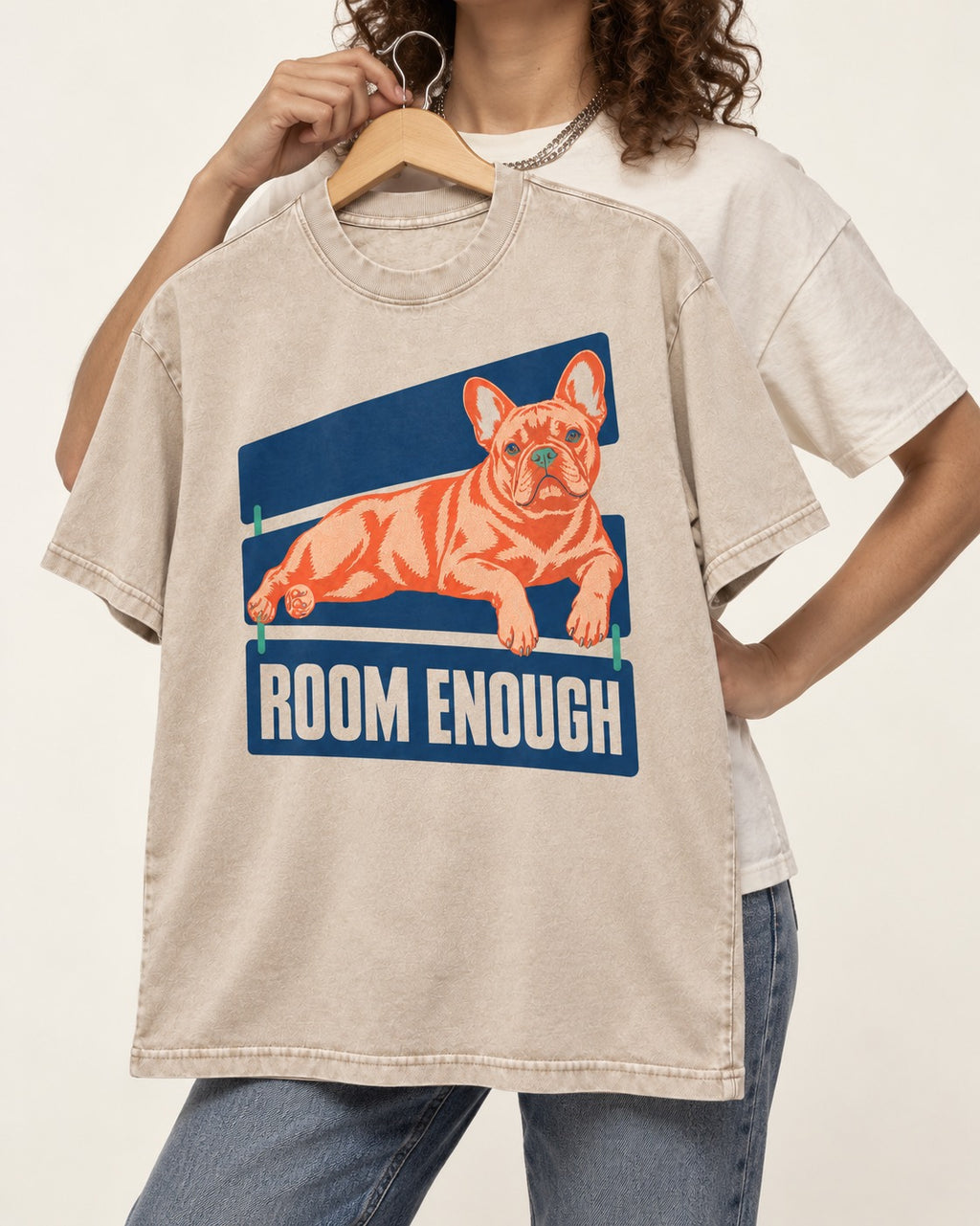 Room Enough for Frenchie Washed Tee in Apricot, held up on a hanger