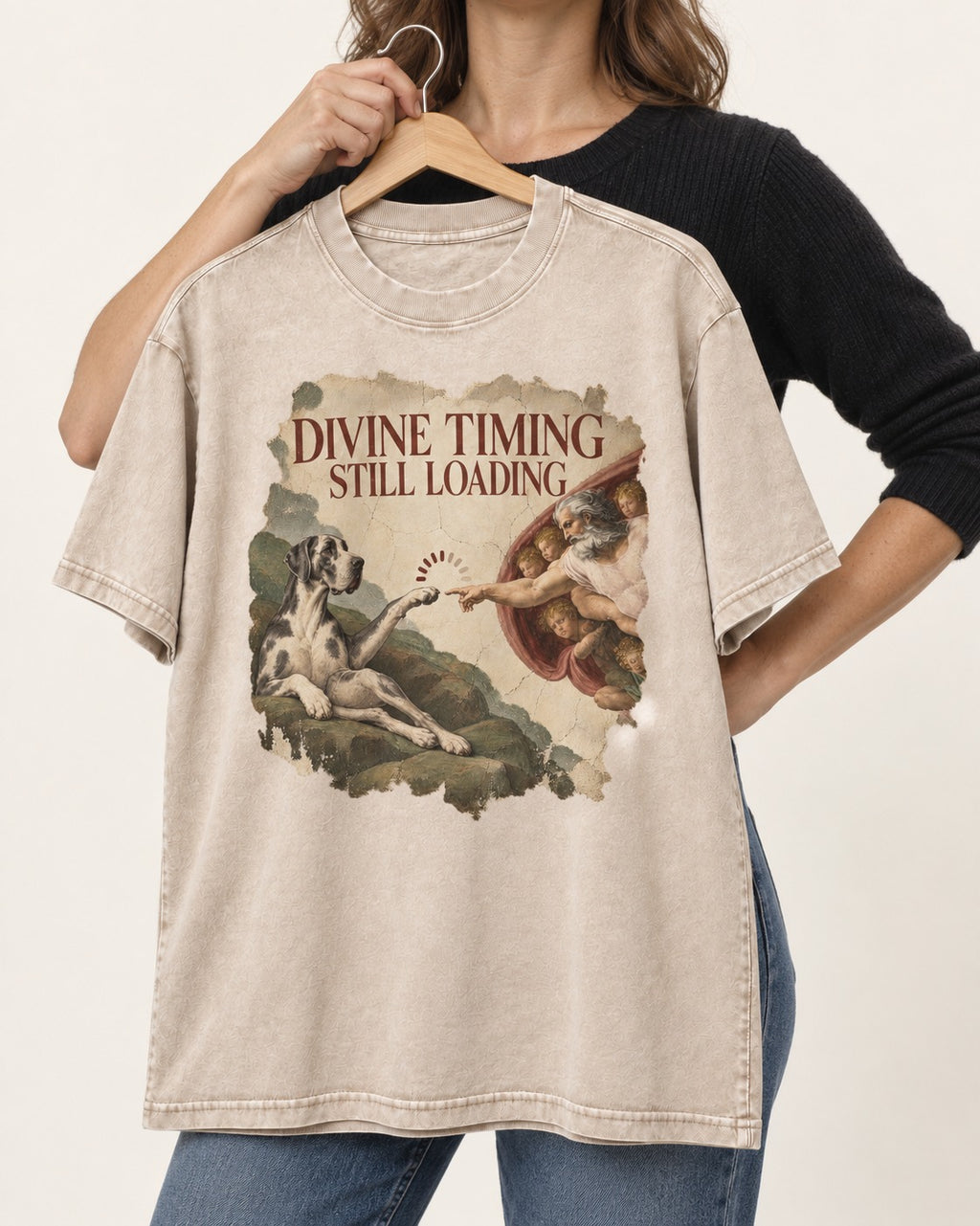 Great Dane Divine Timing Still Loading Washed Tee in Apricot, held up on a hanger