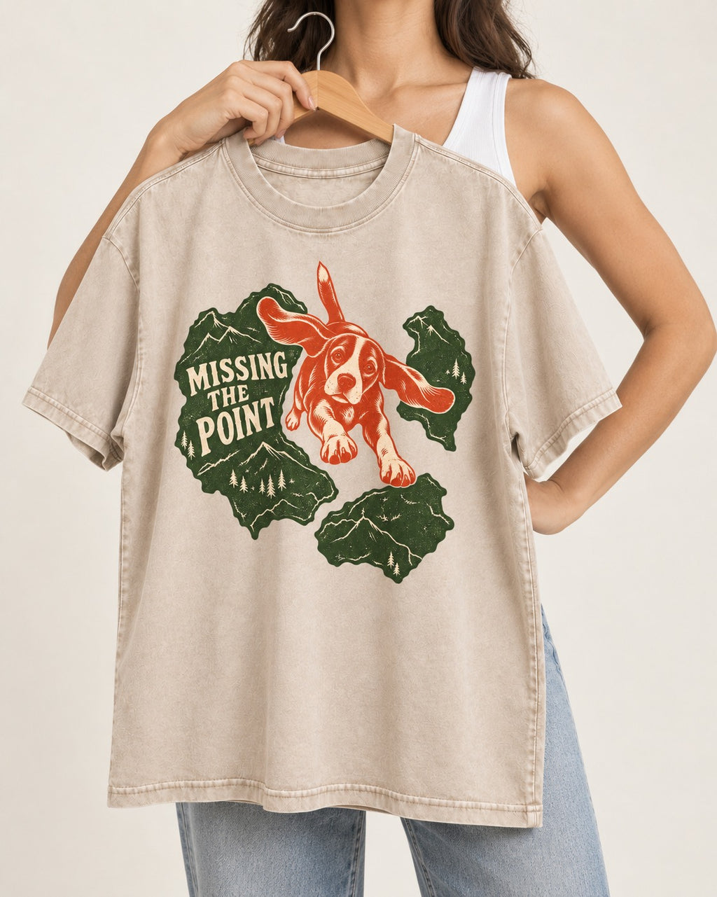 Missing The Point Beagle Trail Washed Tee in Apricot, held up on a hanger
