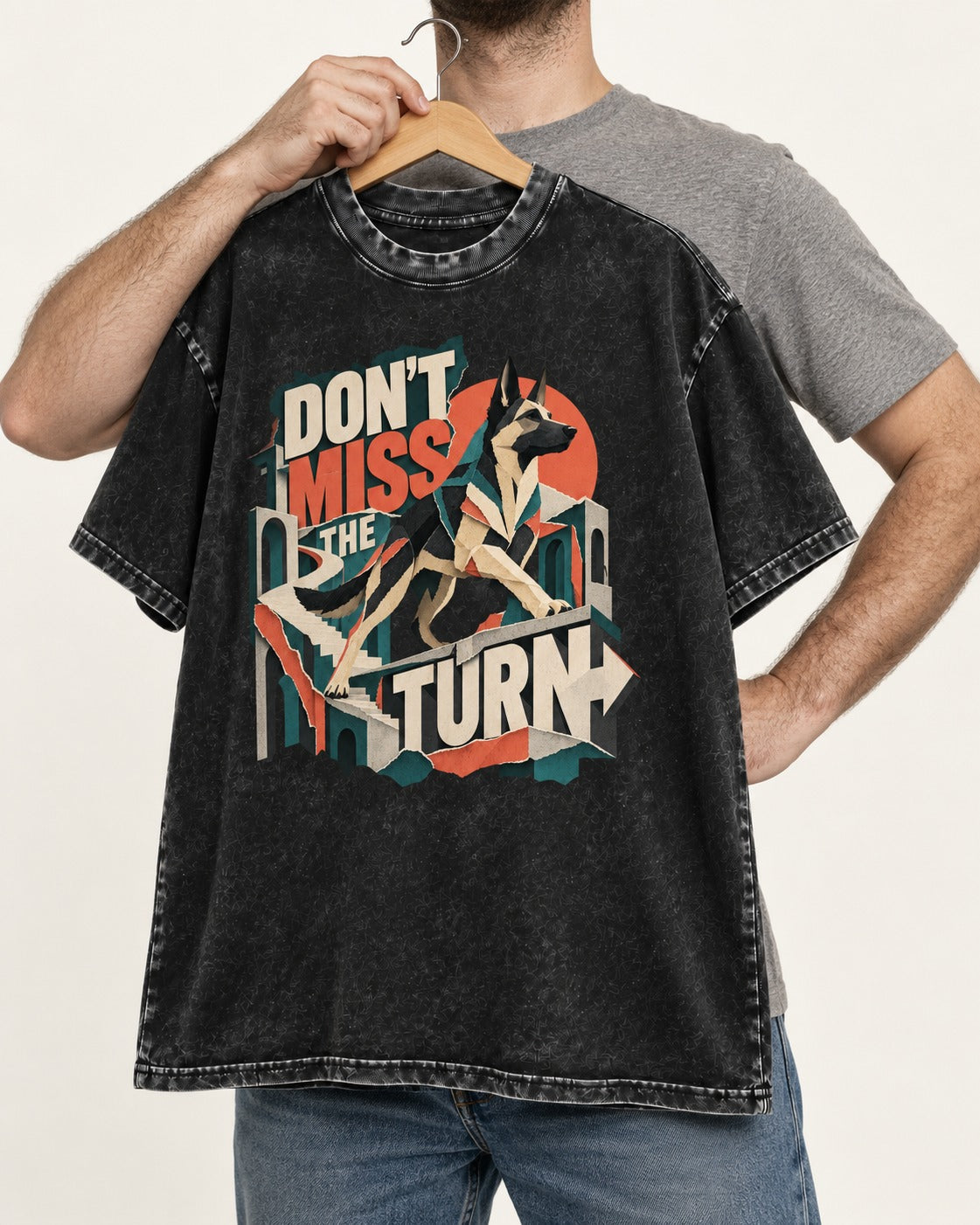Dont Miss The Turn Escher Staircase German Shepherd Dog Graphic Washed Tee in Black, held up on a hanger