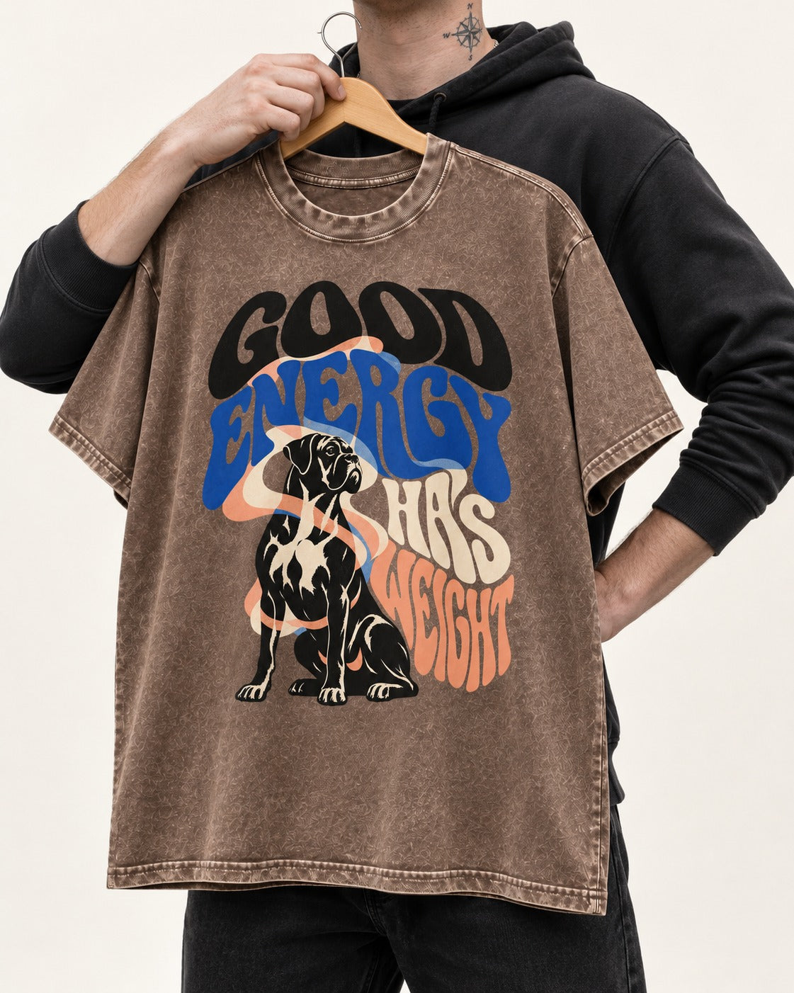 Good Energy Has Weight Boxer Retro Typography Washed Tee in Coffee, held up on a hanger