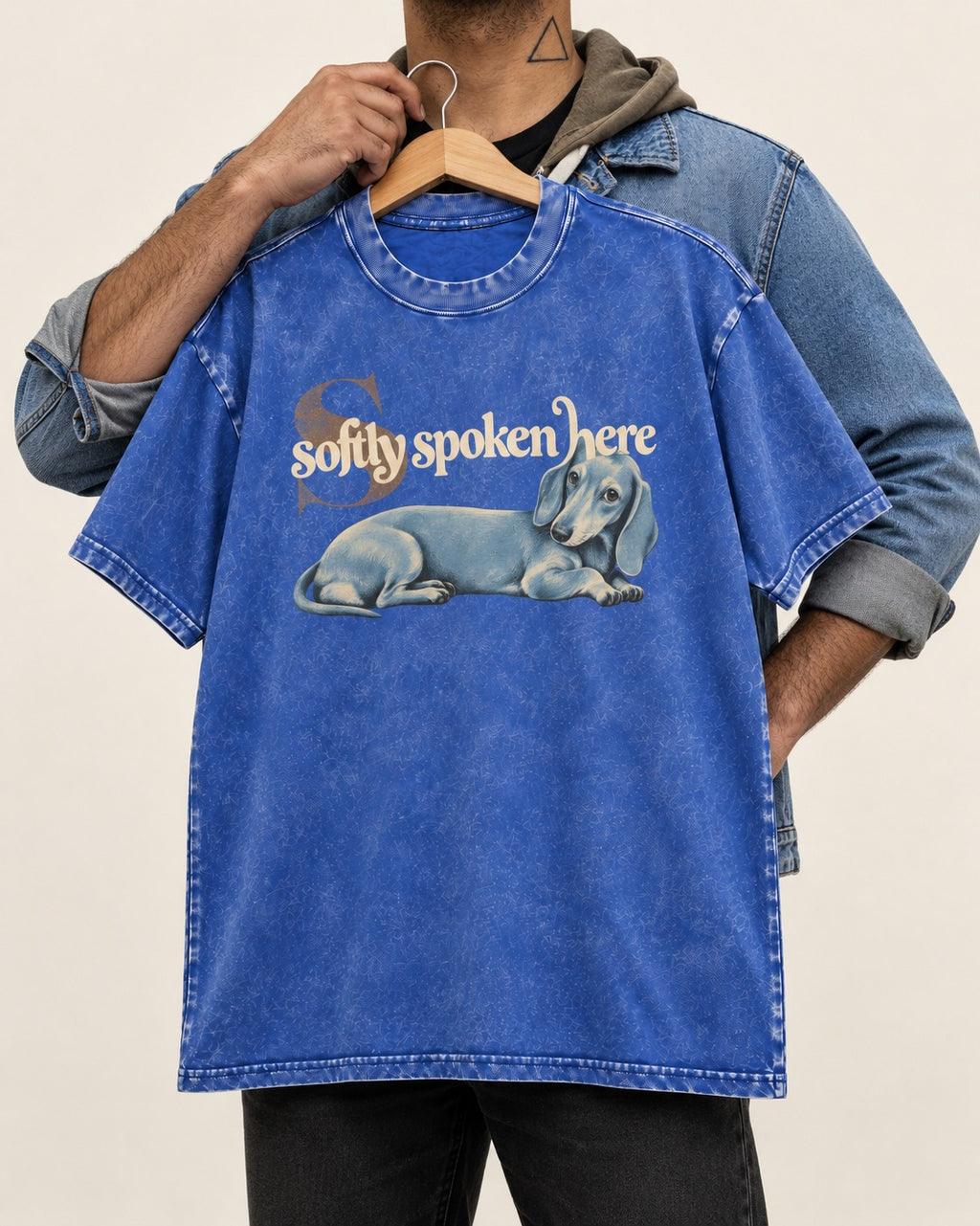Dachshund Softly Spoken Here Reclining Portrait Graphic Washed Tee in Royal Blue, held up on a hanger