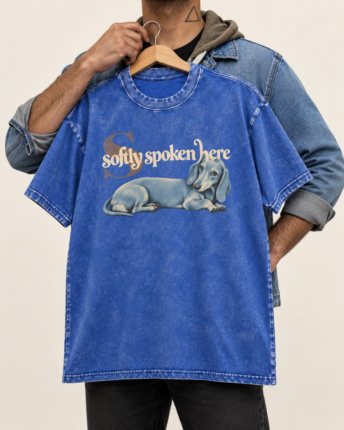 Dachshund Softly Spoken Here Reclining Portrait Graphic Washed Tee in Royal Blue, held up on a hanger