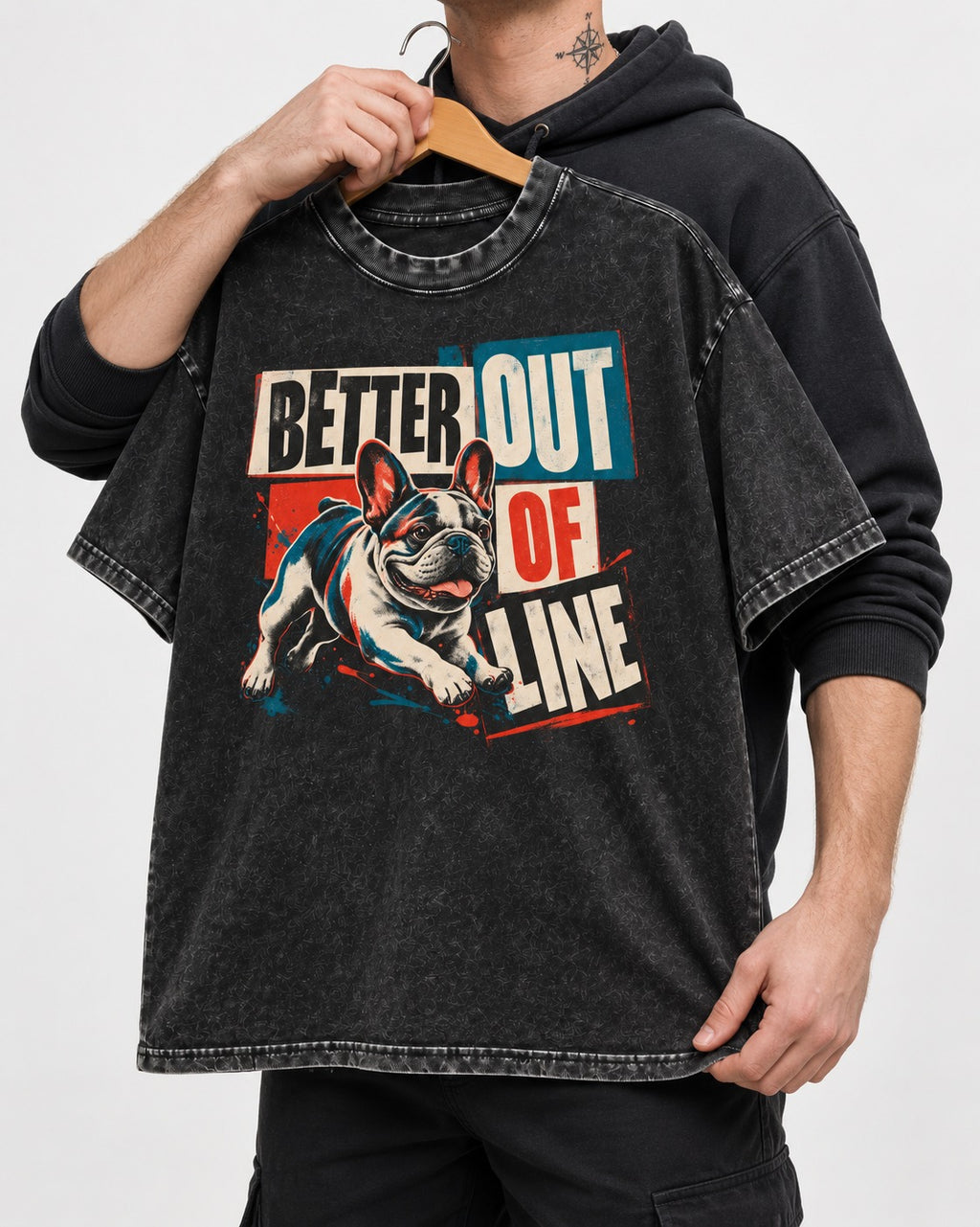 Frenchie Better Out of Line Running Graphic Washed Tee in Black, held up on a hanger