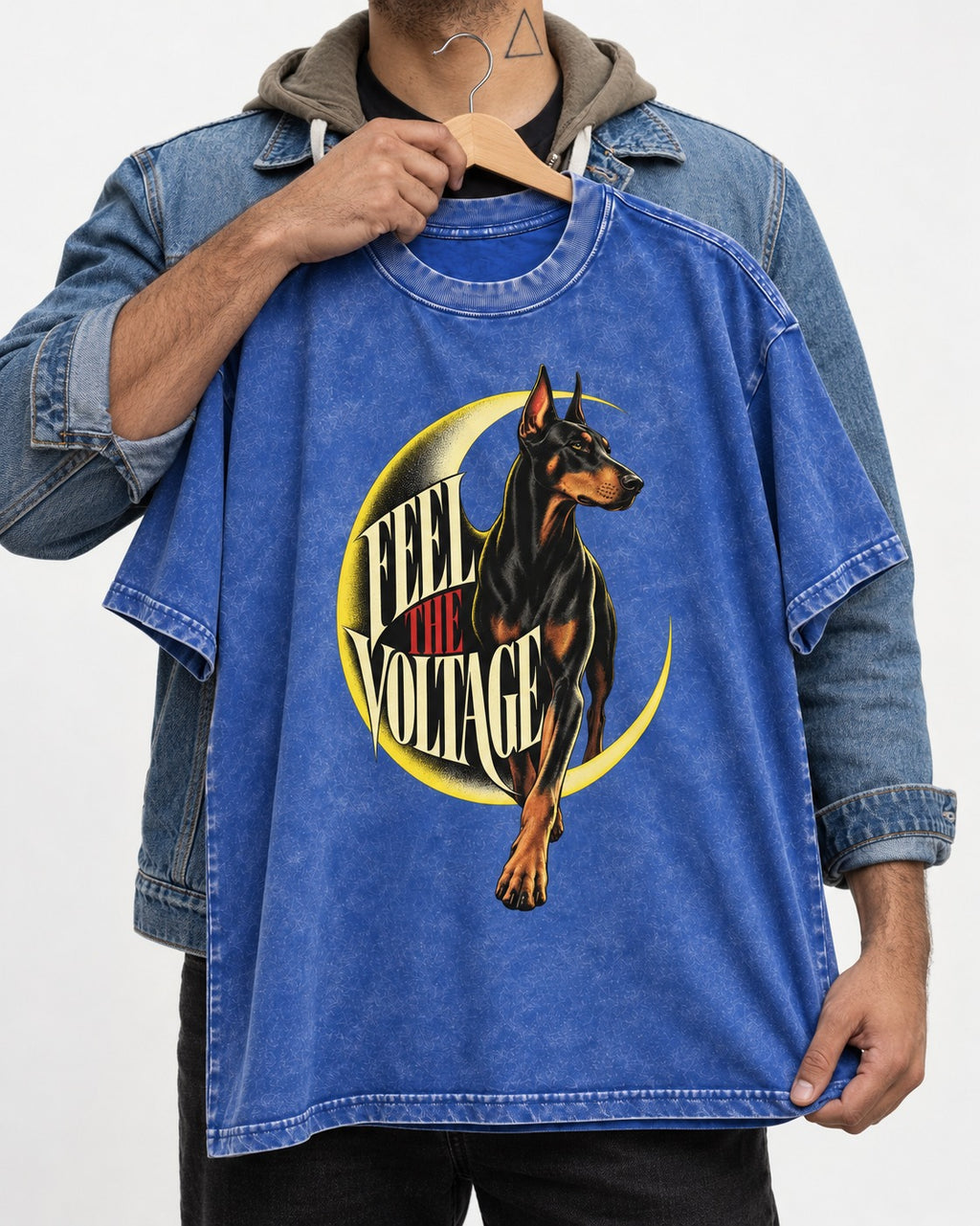 Doberman Feel the Voltage Crescent Portrait Graphic Washed Tee in Royal Blue, held up on a hanger