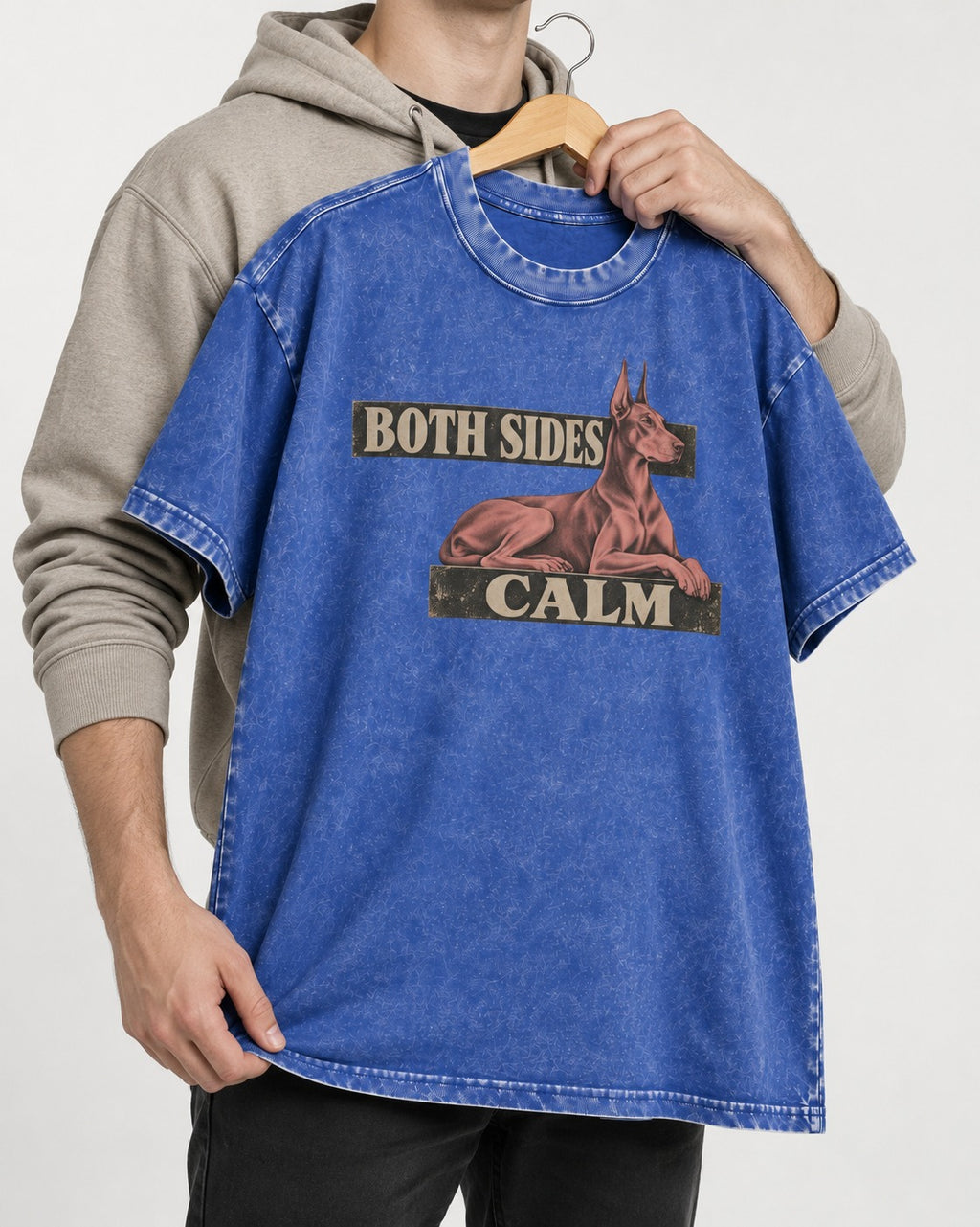Doberman Both Sides Calm Banner Washed Tee in Royal Blue, held up on a hanger