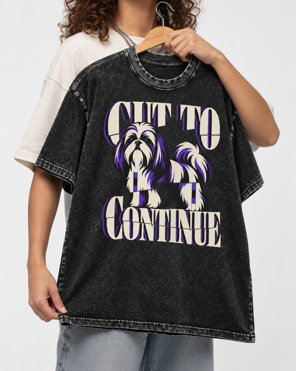 Shih Tzu Cut to Continue Dimensional Typography Graphic Washed Tee in Black, held up on a hanger